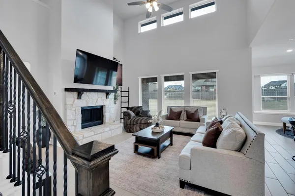 a living room with furniture fireplace and flat screen tv