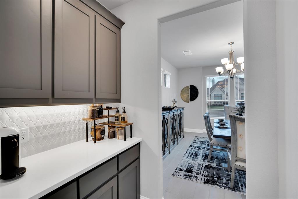 4605 Rambler Way Midlothian, TX 76065 - Photo 13 of 40 a bathroom with a sink and a mirror