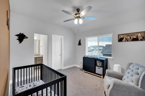 a view of livingroom with furniture and chandelier fan
