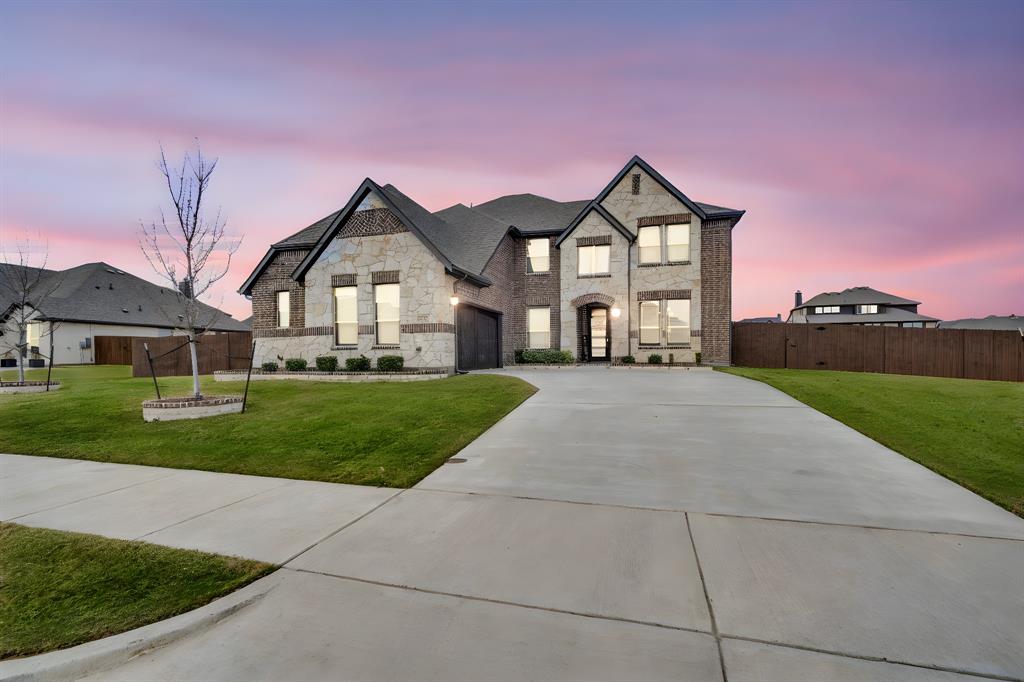 4605 Rambler Way Midlothian, TX 76065 - Photo 3 of 40 a front view of a house with yard and green space