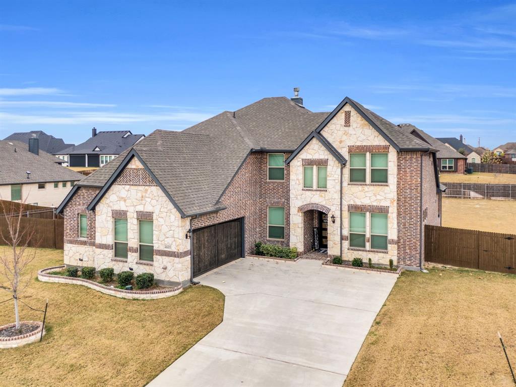 4605 Rambler Way Midlothian, TX 76065 - Photo 5 of 40 a front view of a house with a yard