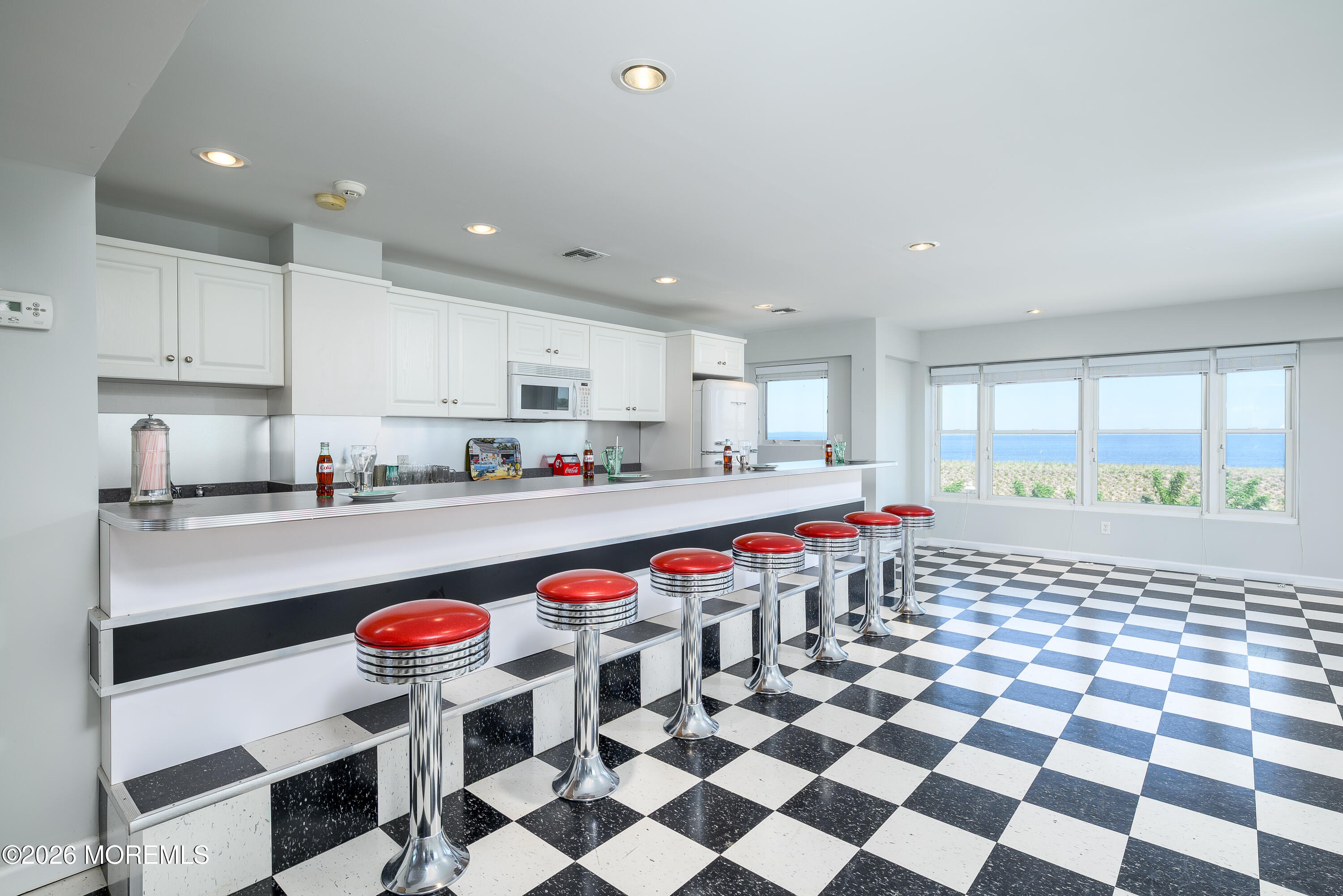 805 Front Street Union Beach, NJ 07735 - Photo 28 of 65 a kitchen with stainless steel appliances kitchen island granite countertop a sink and cabinets