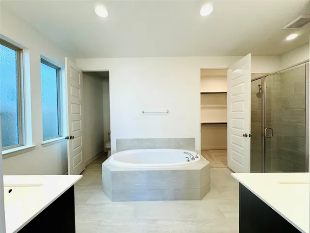 a view of hallway with stairs and wooden floor