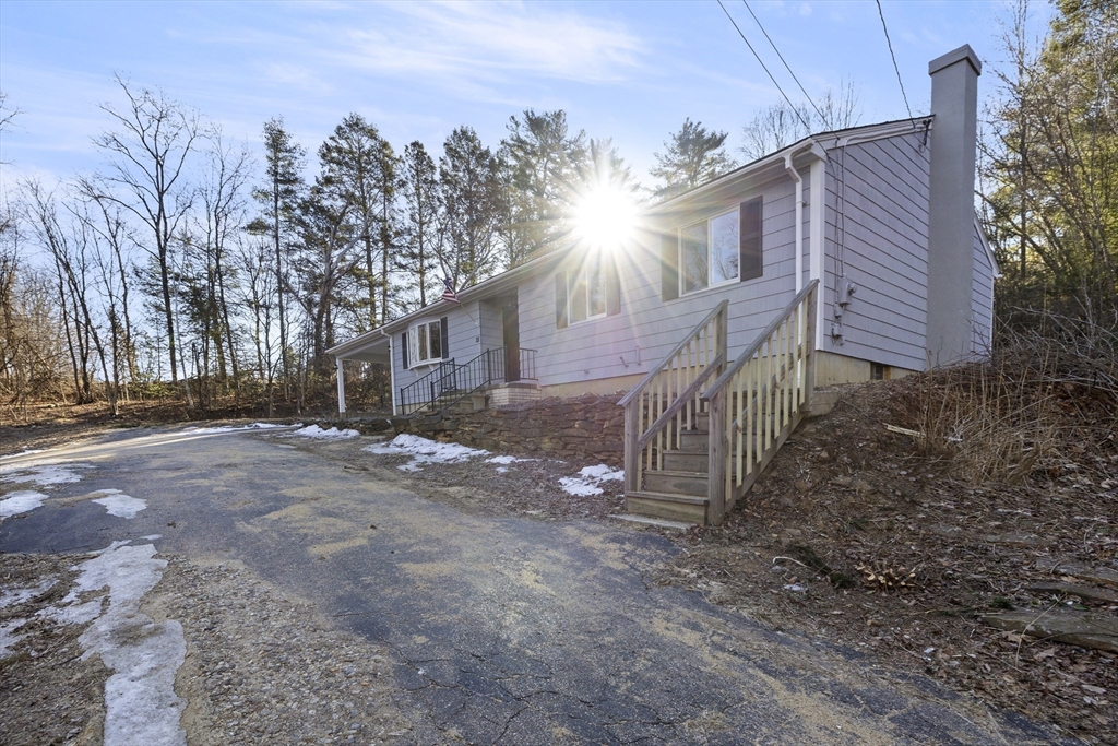 28 Long Hill Road Brookfield, MA 01506 - Photo 30 of 37 a view of a house with a yard and wooden fence