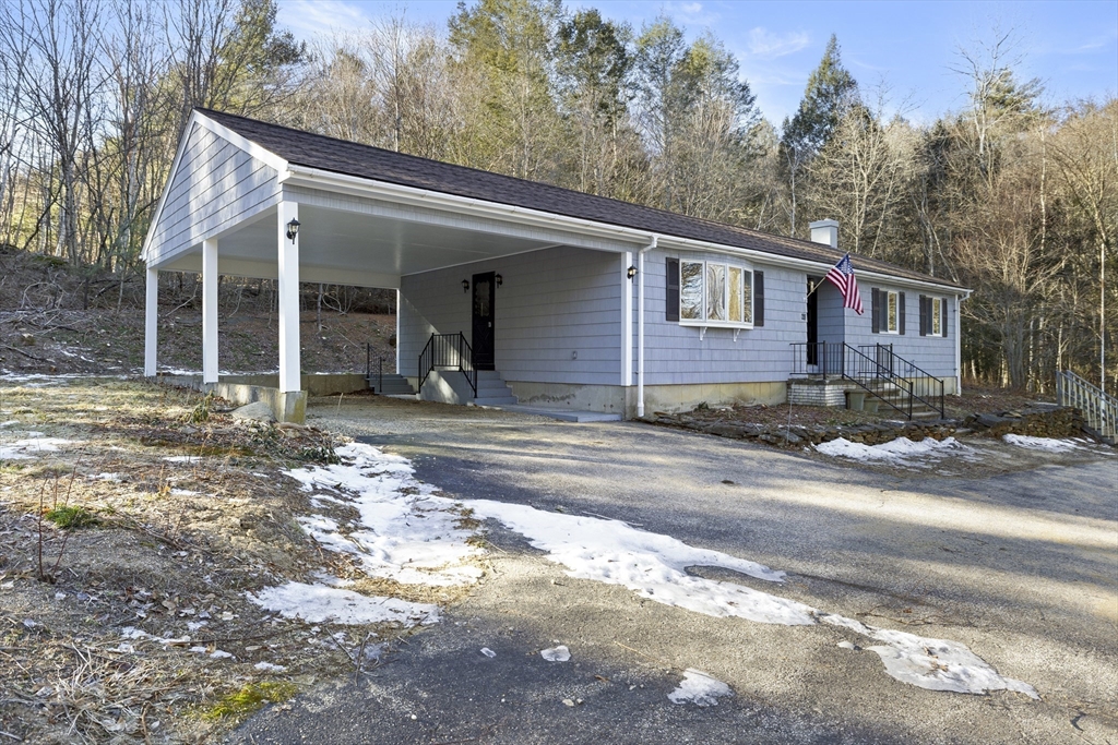 28 Long Hill Road Brookfield, MA 01506 - Photo 31 of 37 a front view of a house with a yard