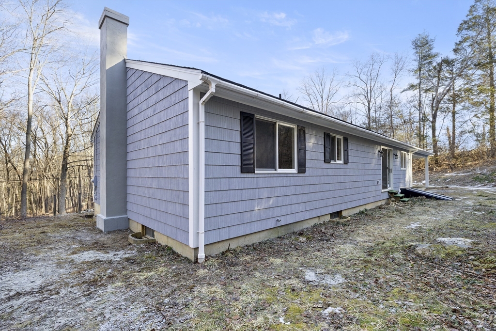 28 Long Hill Road Brookfield, MA 01506 - Photo 34 of 37 a view of a house with a back yard