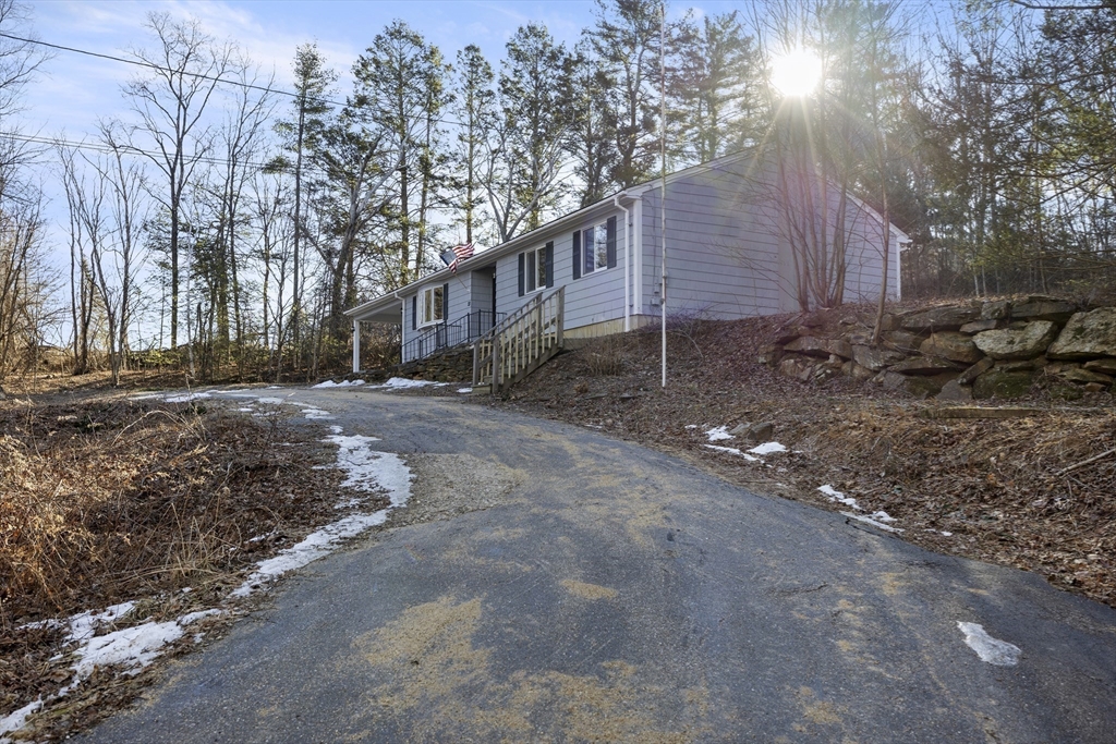 28 Long Hill Road Brookfield, MA 01506 - Photo 5 of 37 a backyard of a house with lots of green space