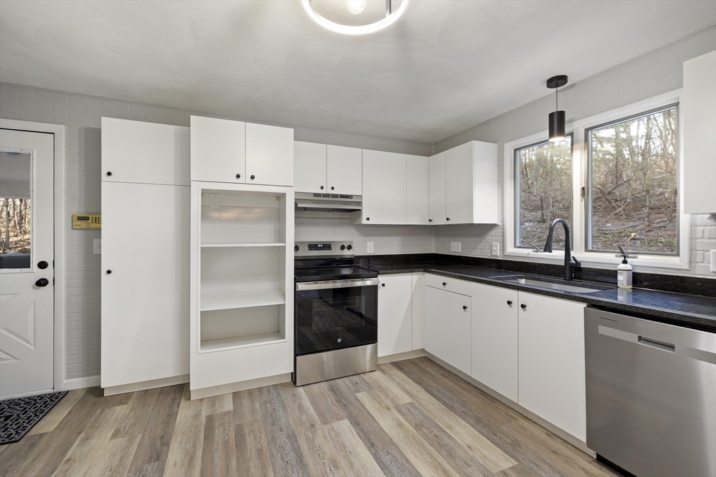 28 Long Hill Road Brookfield, MA 01506 - Photo 6 of 37 a kitchen with granite countertop a stove and a sink