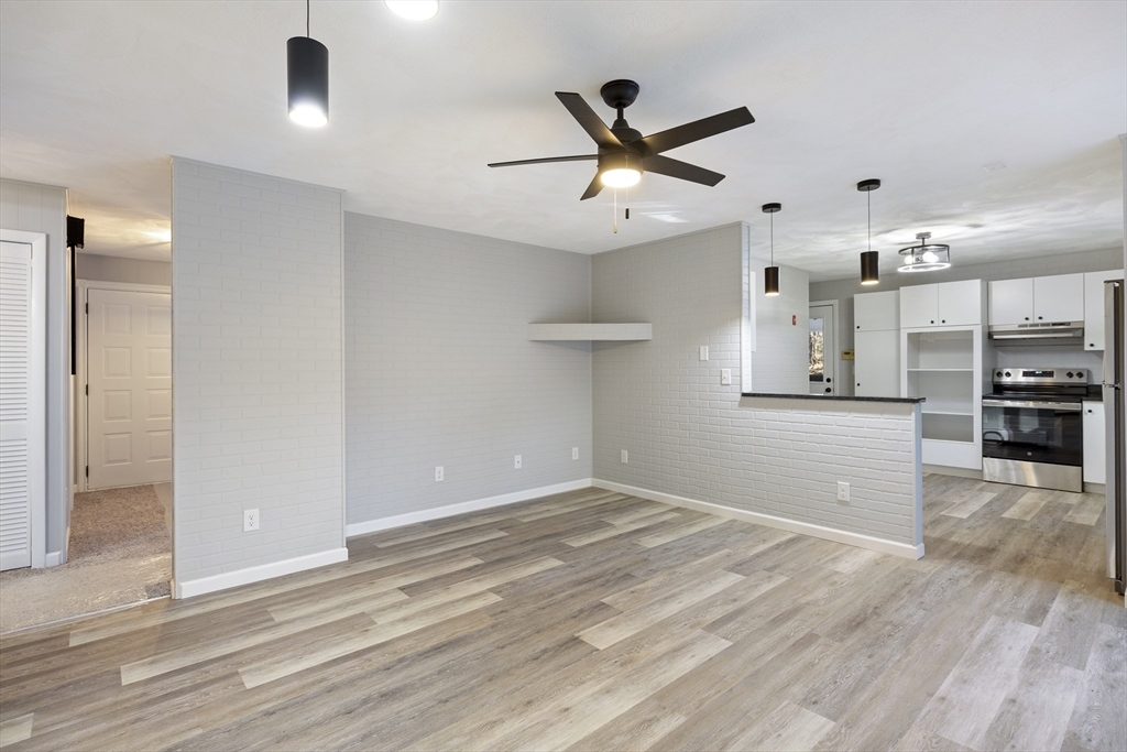 28 Long Hill Road Brookfield, MA 01506 - Photo 9 of 40 a view of a kitchen with a dishwasher and a refrigerator