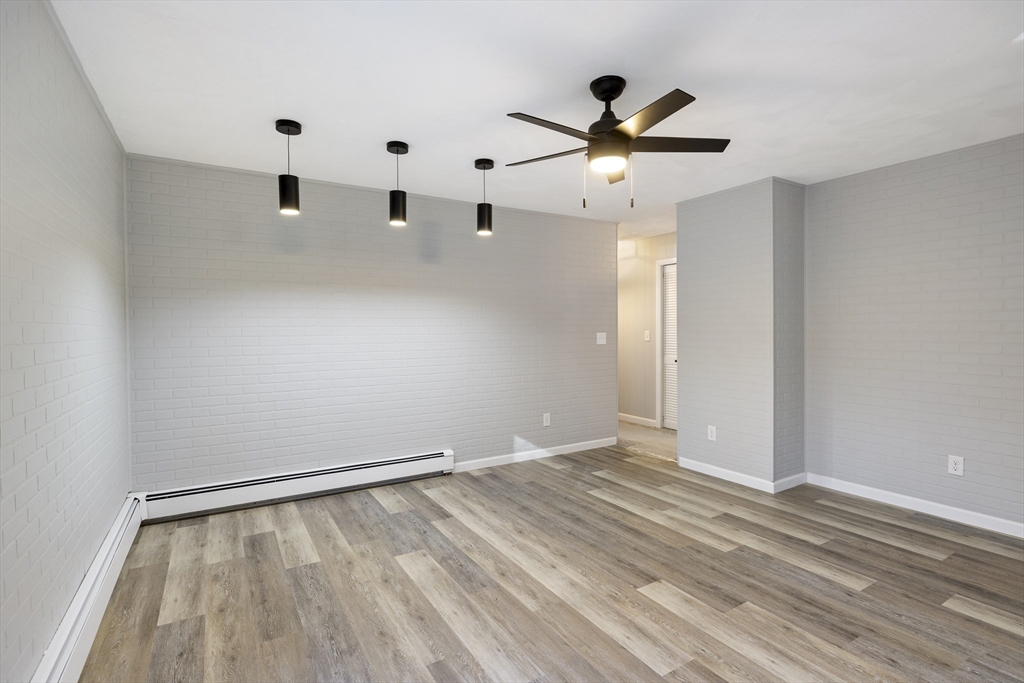 28 Long Hill Road Brookfield, MA 01506 - Photo 10 of 40 a view of empty room with wooden floor
