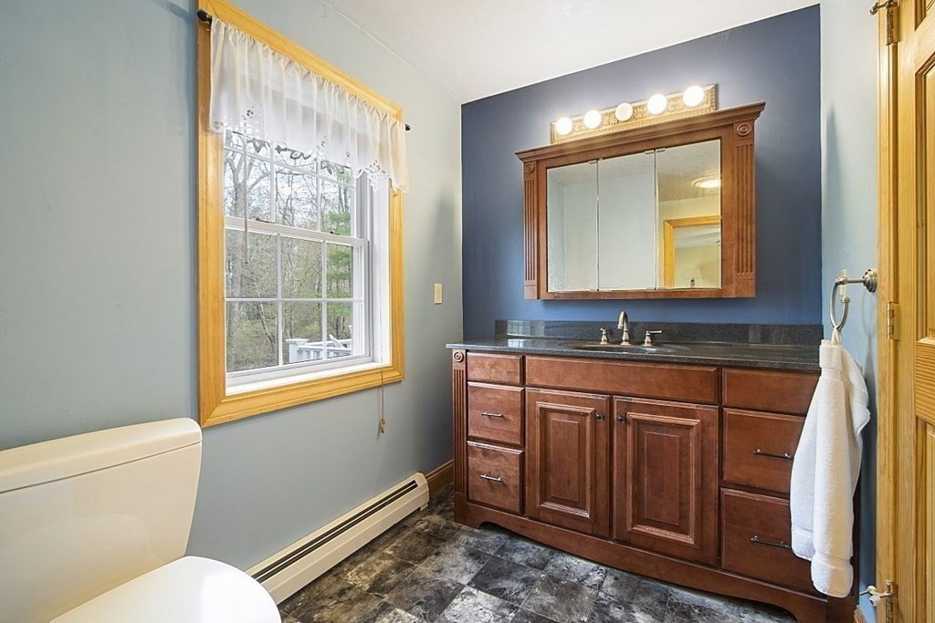 23 Town Farm Road Brookfield, MA 01506 - Photo 25 of 32 a bathroom with a toilet sink and mirror