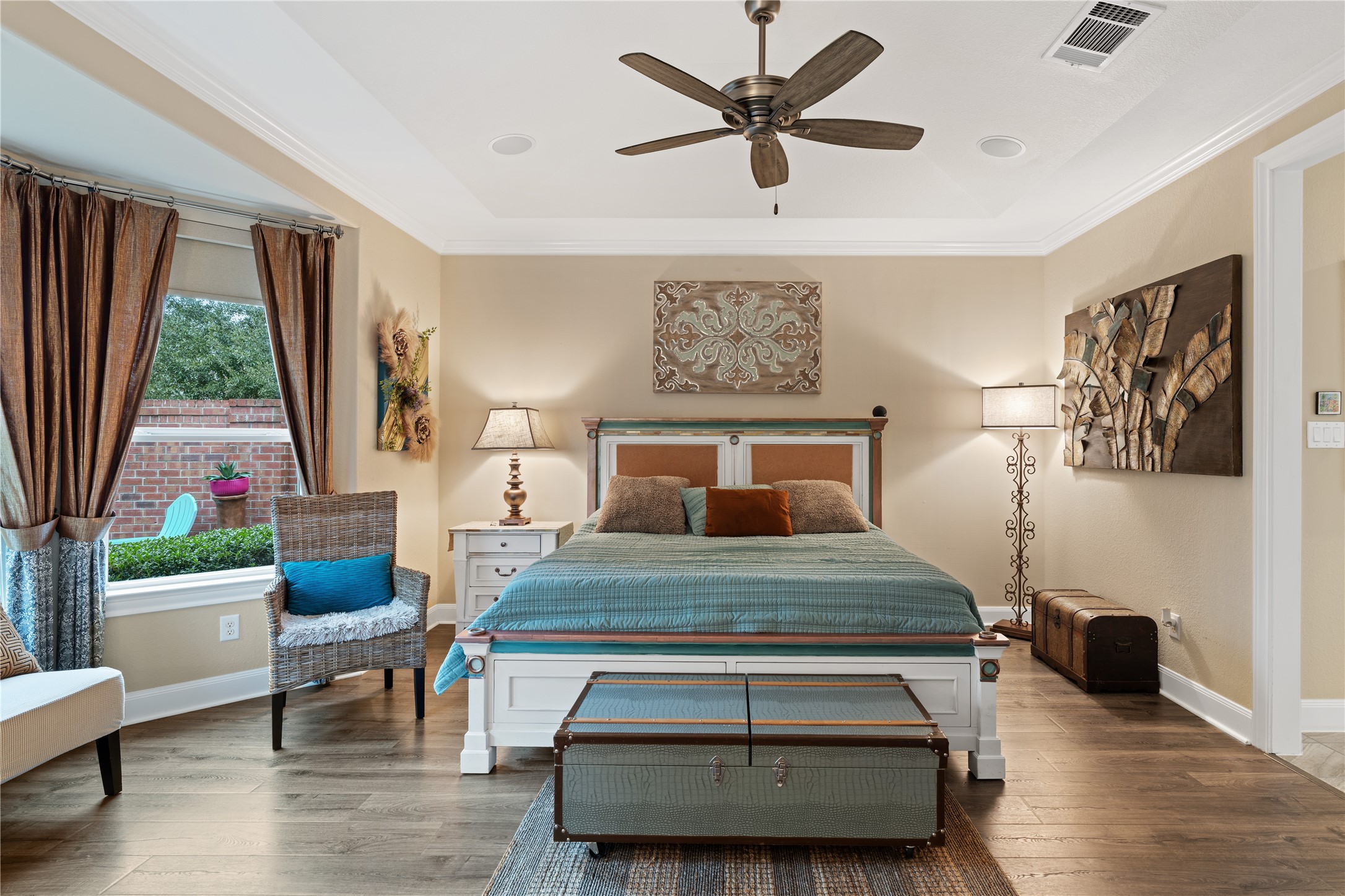 51 Scepter Ridge Sugar Land, TX 77498 - Photo 25 of 48 The Primary Bedroom is located on the first floor with direct views of the professionally landscaped back yard. Crown molding, cozy sitting area and a spa inspired bath make this Primary suite fit for royalty!
