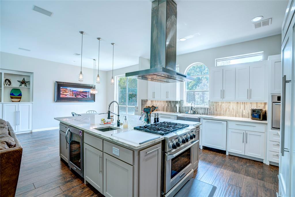 800 Woodcrest Court Southlake, TX 76092 - Photo 11 of 40 a kitchen with a sink stove and wooden floor