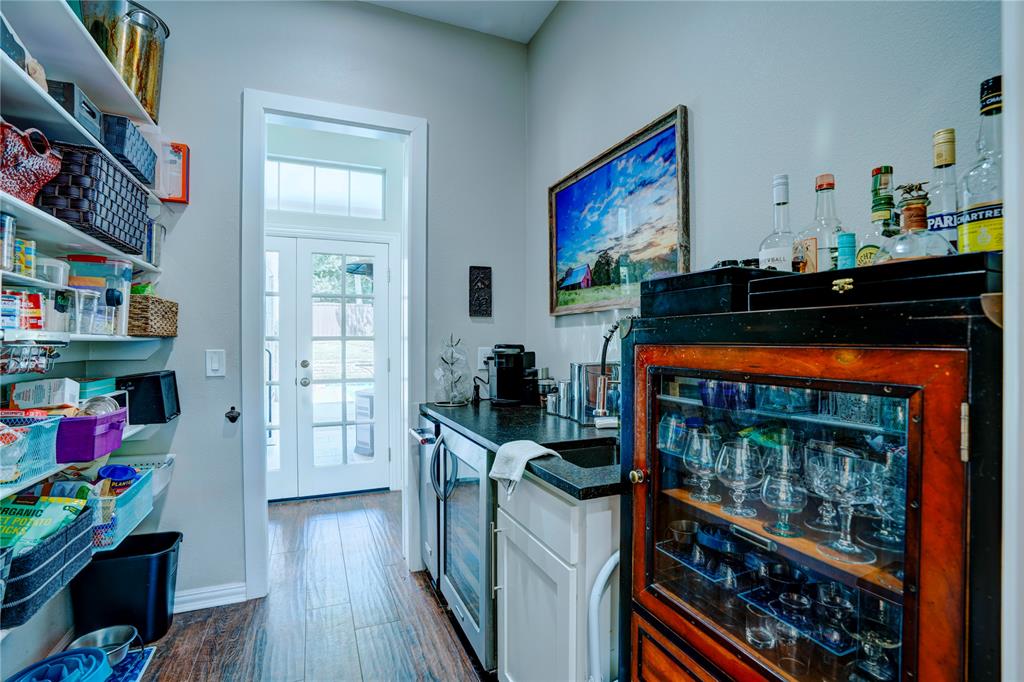 800 Woodcrest Court Southlake, TX 76092 - Photo 12 of 40 a view of a workspace with furniture and wooden floor