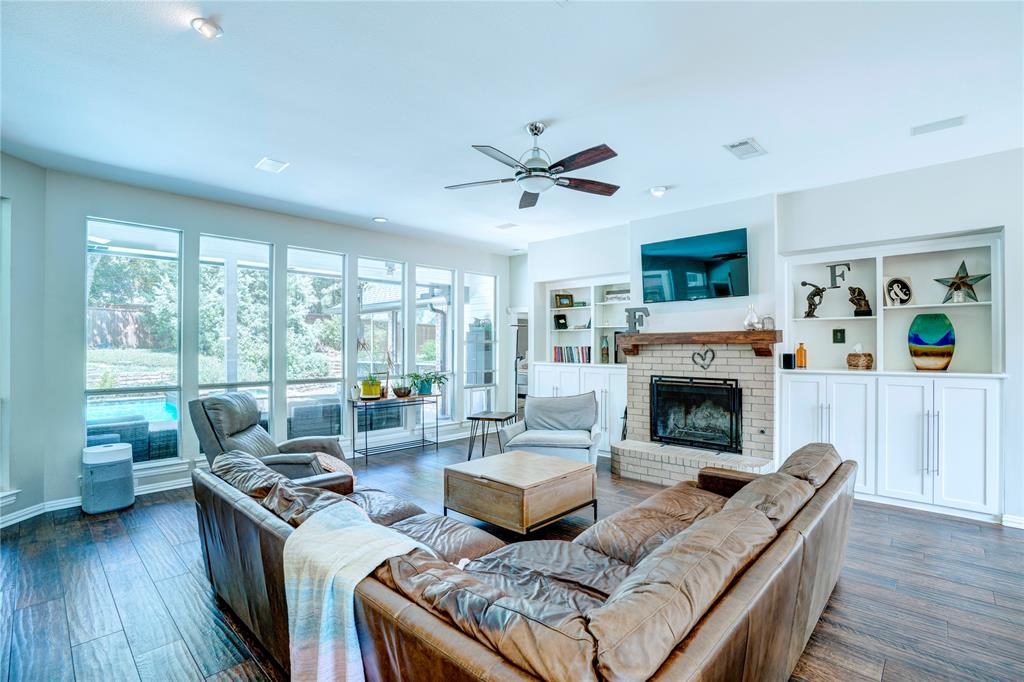 800 Woodcrest Court Southlake, TX 76092 - Photo 15 of 40 a living room with furniture and a fireplace