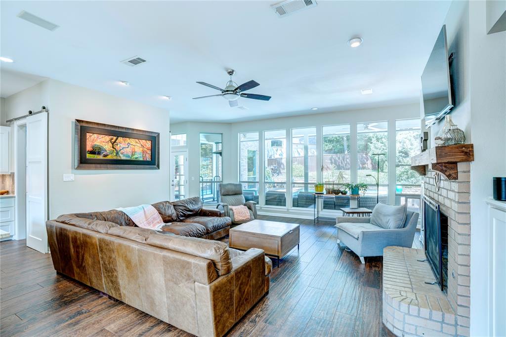 800 Woodcrest Court Southlake, TX 76092 - Photo 16 of 40 a living room with fireplace furniture and a flat screen tv