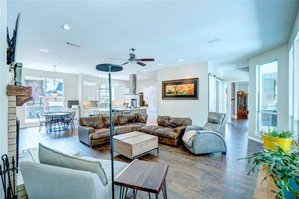 800 Woodcrest Court Southlake, TX 76092 - Photo 17 of 40 a living room with furniture kitchen view and a wooden floor