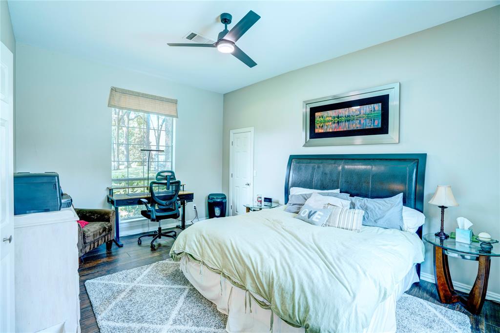 800 Woodcrest Court Southlake, TX 76092 - Photo 19 of 40 a bedroom with a bed and a desk