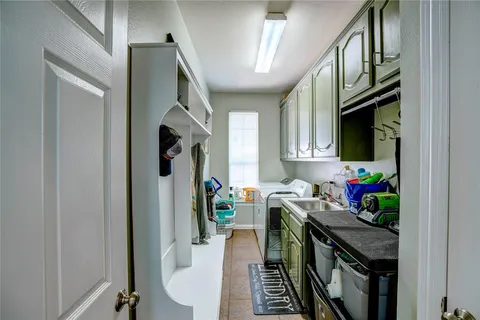 a view of a hallway with workspace and windows