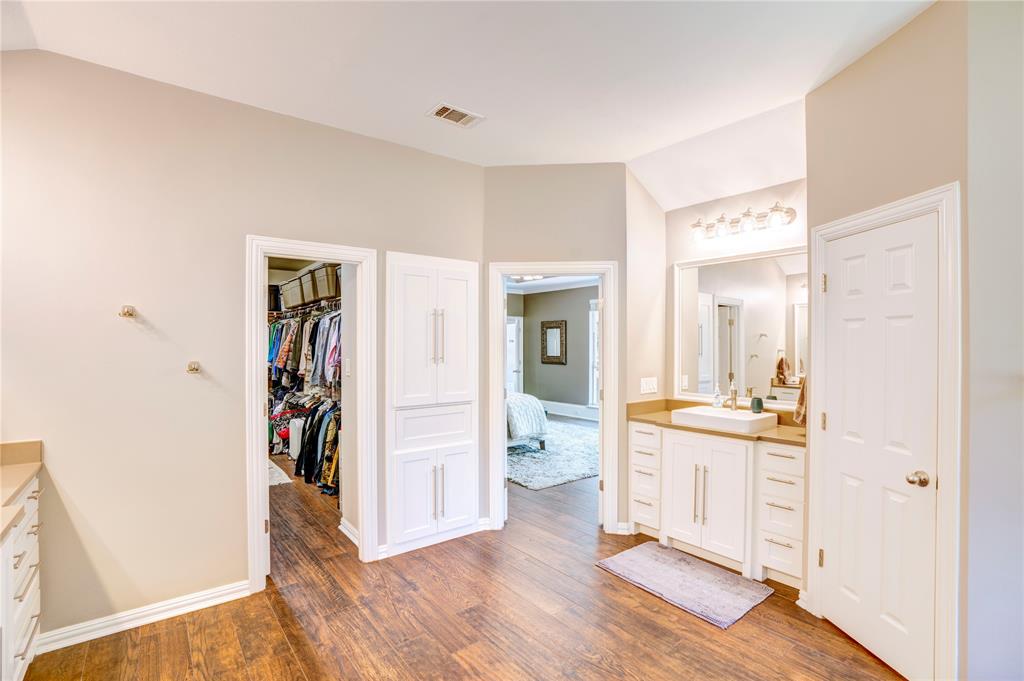 800 Woodcrest Court Southlake, TX 76092 - Photo 26 of 40 a view of a room with wooden floor and furniture