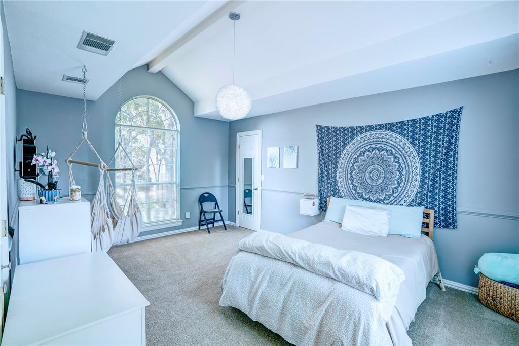 800 Woodcrest Court Southlake, TX 76092 - Photo 29 of 40 a bedroom with a bed and a large window