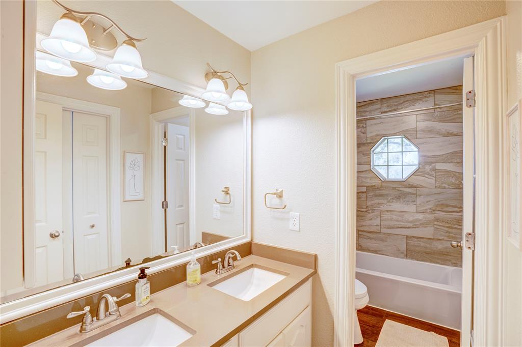 800 Woodcrest Court Southlake, TX 76092 - Photo 30 of 40 a bathroom with a sink tub and shower