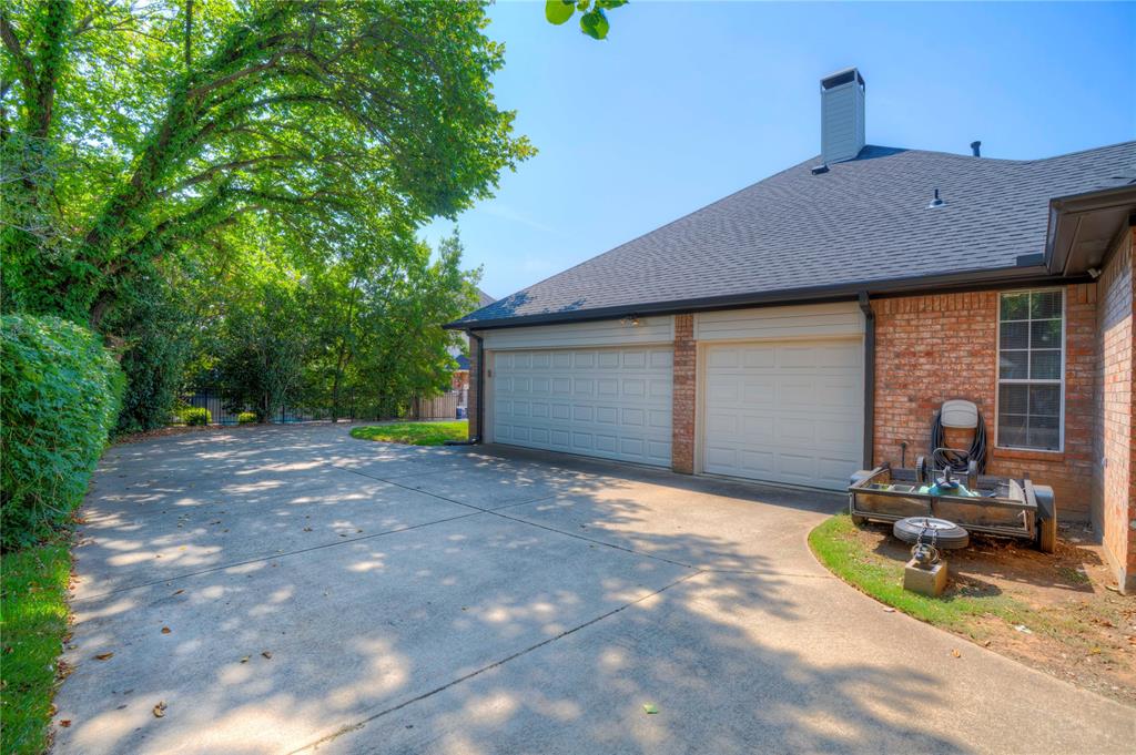 800 Woodcrest Court Southlake, TX 76092 - Photo 32 of 40 a view of a house with backyard and garden