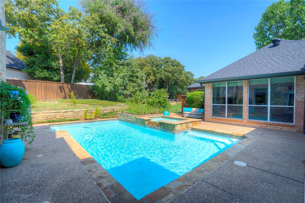 800 Woodcrest Court Southlake, TX 76092 - Photo 33 of 40 a view of a backyard with swimming pool