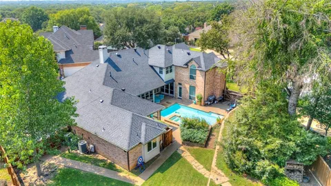 an aerial view of a house with a garden