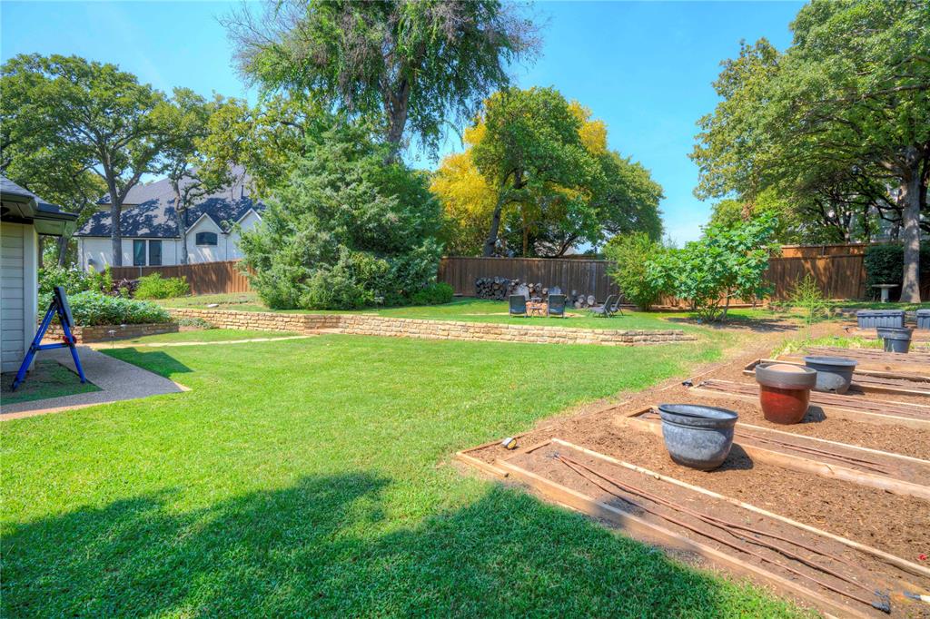 800 Woodcrest Court Southlake, TX 76092 - Photo 36 of 40 a view of a garden with a patio