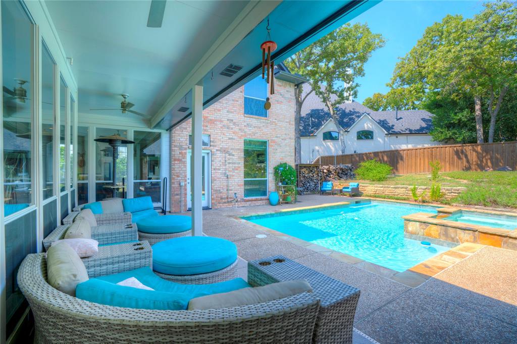 800 Woodcrest Court Southlake, TX 76092 - Photo 40 of 40 a living room with patio furniture and a swimming pool