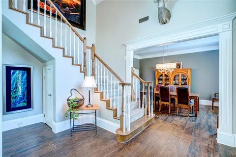 a view of entryway dining room and hall with wooden floor