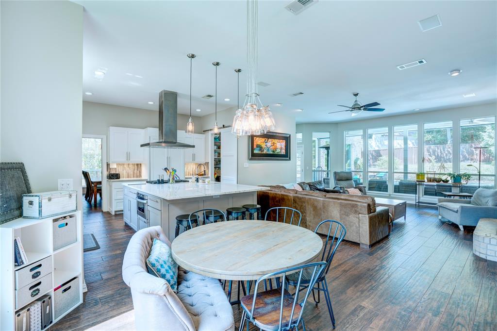 800 Woodcrest Court Southlake, TX 76092 - Photo 8 of 40 a view of a dining room with furniture and wooden floor