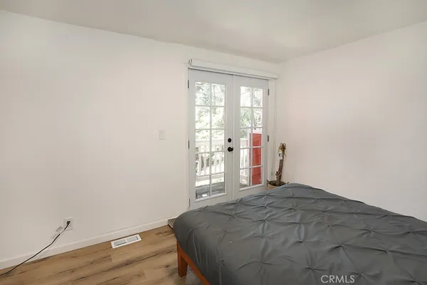 a large kitchen with cabinets table and chairs