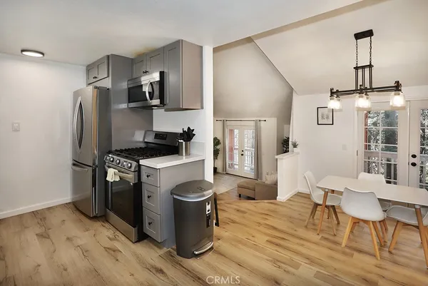 a stove top oven sitting inside of a kitchen