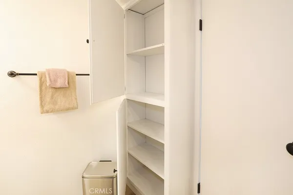 a bathroom with a shower sink vanity and mirror