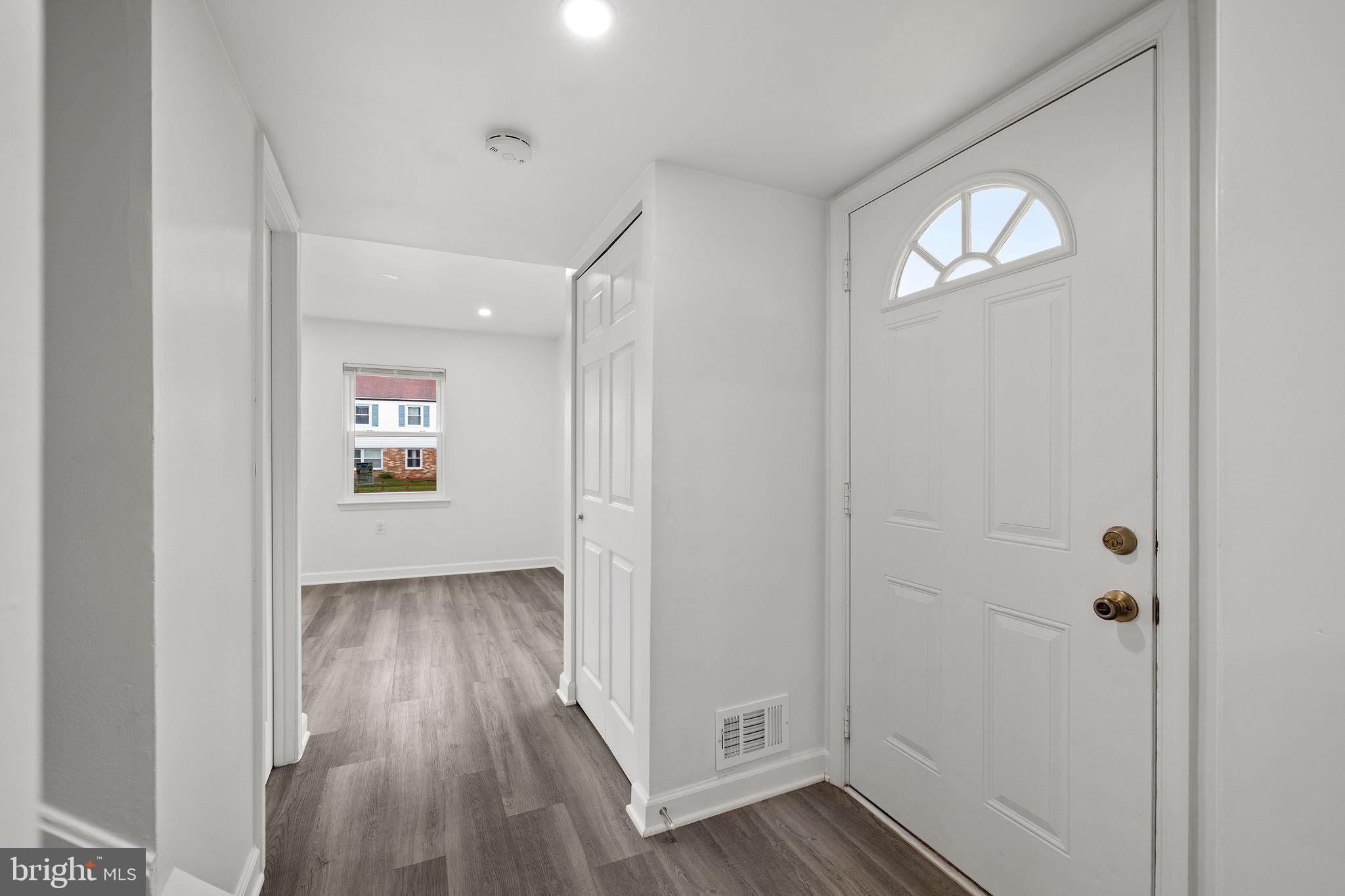 8157 Community Drive Manassas, VA 20109 - Photo 12 of 37 an empty room with wooden floor closet and windows