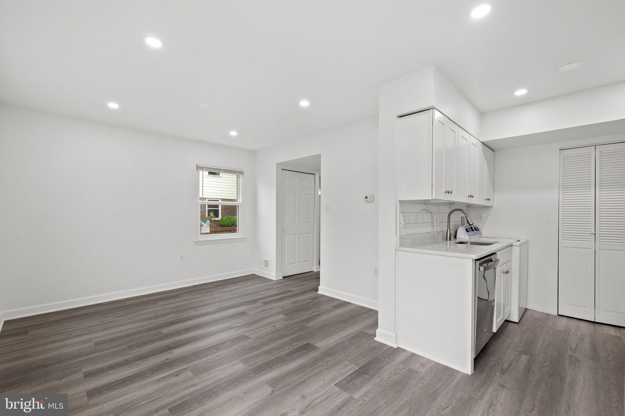 8157 Community Drive Manassas, VA 20109 - Photo 18 of 37 a kitchen with a sink wooden floor and a refrigerator