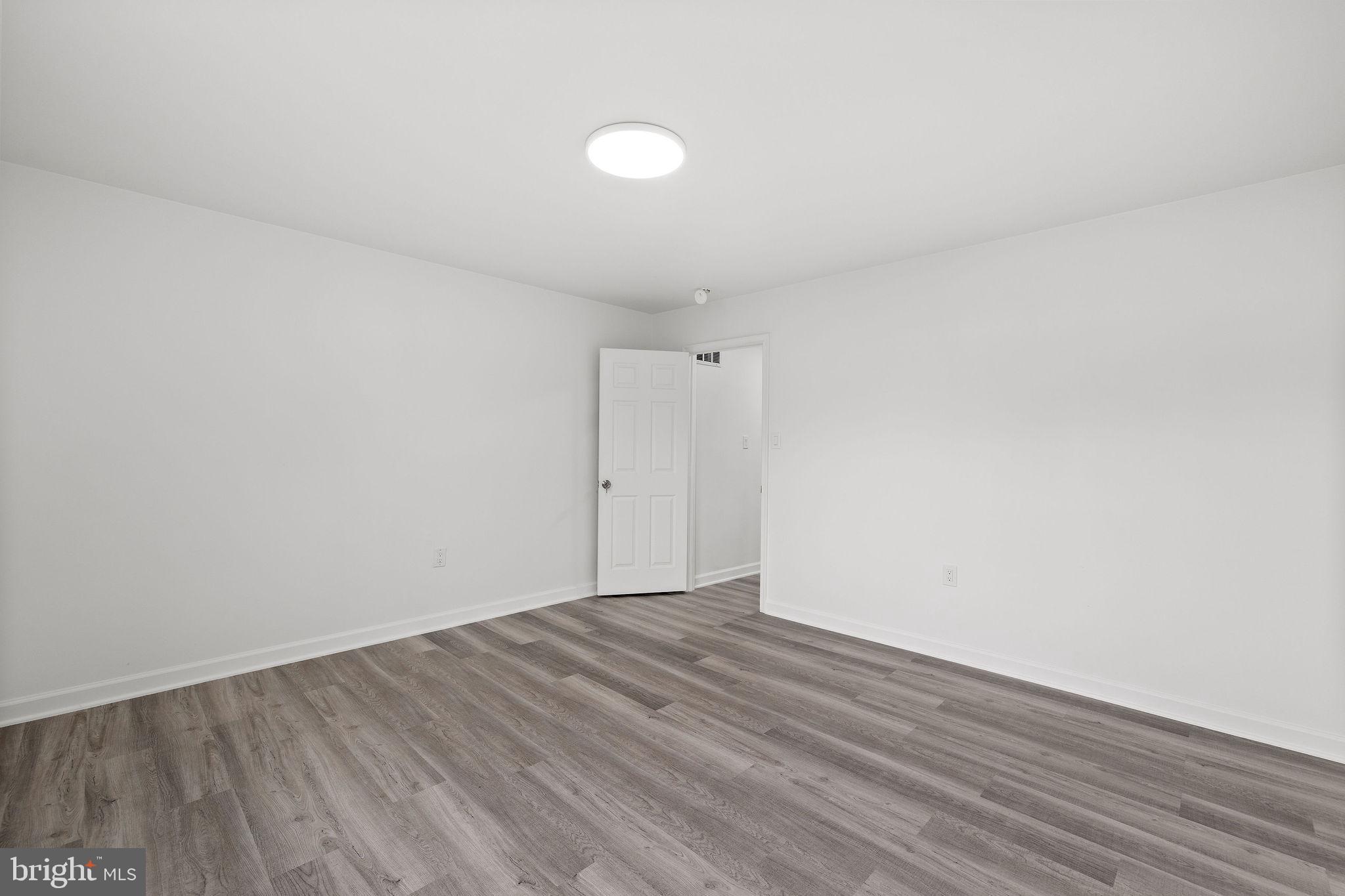 8157 Community Drive Manassas, VA 20109 - Photo 24 of 37 a view of an empty room with wooden floor