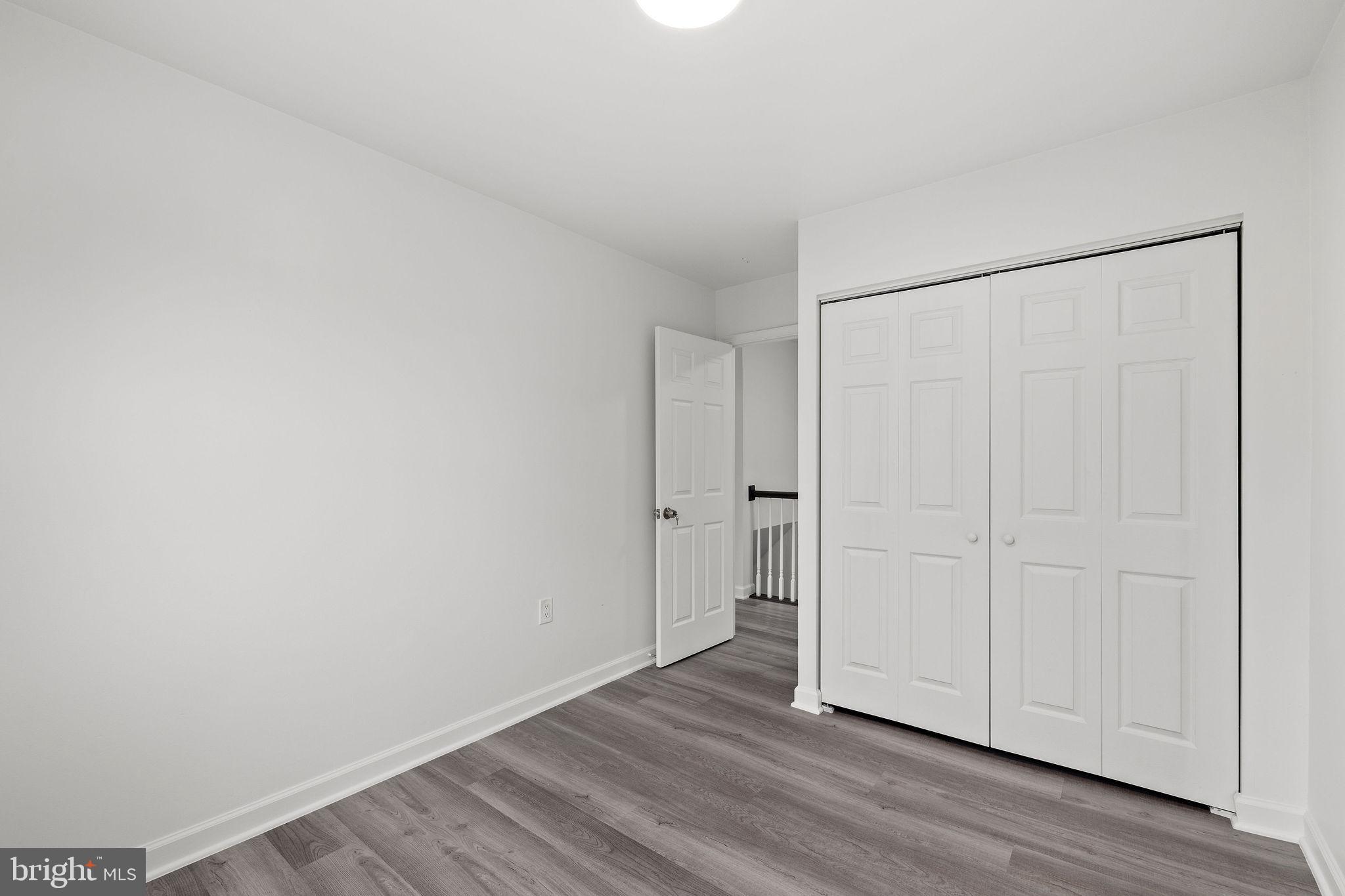 8157 Community Drive Manassas, VA 20109 - Photo 30 of 37 a view of a room with wooden floor