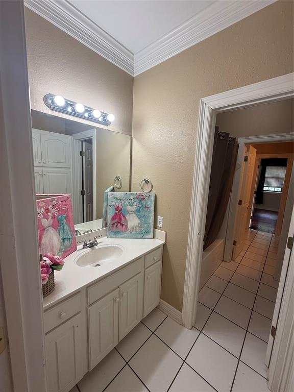 201 Woodhaven Drive Minden, LA 71055 - Photo 17 of 31 Bathroom vanity featuring a single basin sink, white countertop, and white cabinetry