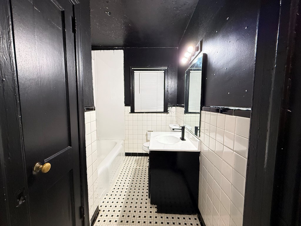 4221 Adams Street Columbus, GA 31907 - Photo 11 of 17 a bathroom with a sink and a mirror