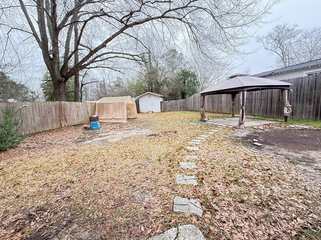4221 Adams Street Columbus, GA 31907 - Photo 14 of 17 a backyard of a house with shaded area