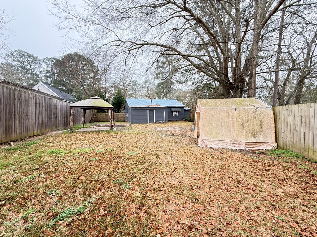 4221 Adams Street Columbus, GA 31907 - Photo 15 of 17 front view of a house with a large tree