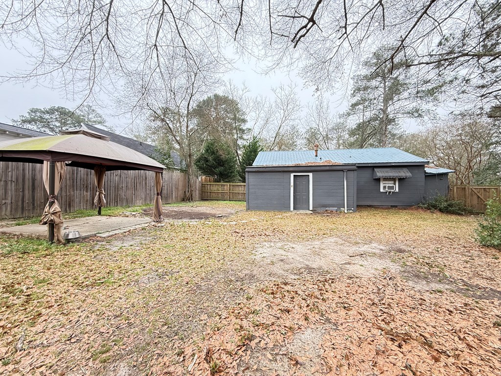 4221 Adams Street Columbus, GA 31907 - Photo 16 of 17 a front view of a house with a yard and a garage