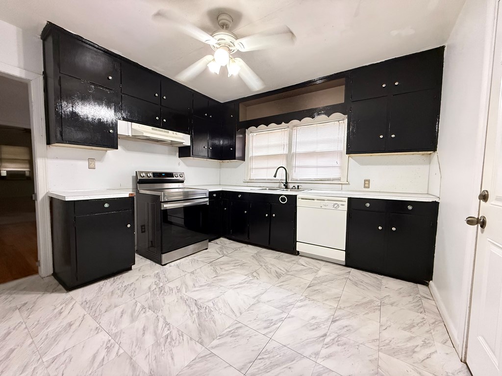4221 Adams Street Columbus, GA 31907 - Photo 5 of 17 a kitchen with a sink and cabinets