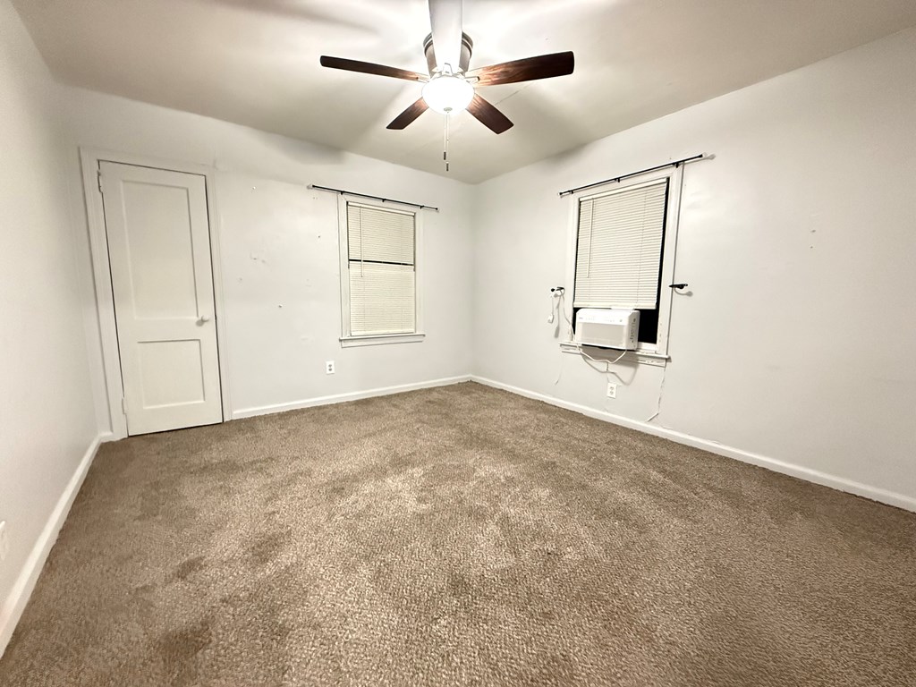 4221 Adams Street Columbus, GA 31907 - Photo 7 of 17 a view of empty room with window and ceiling fan