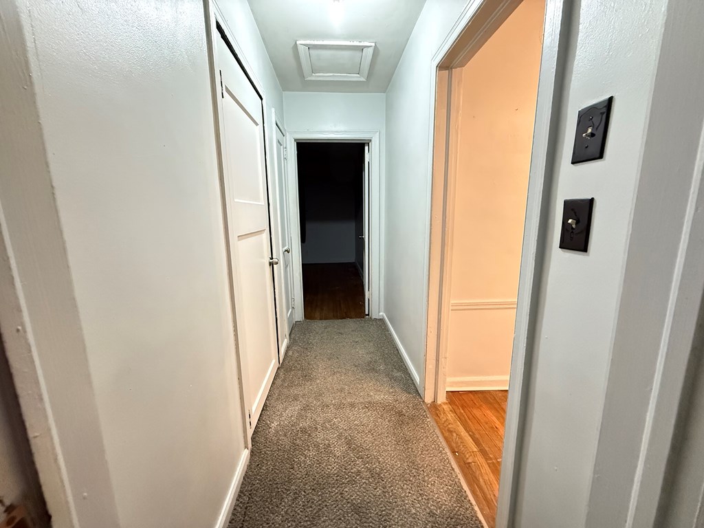4221 Adams Street Columbus, GA 31907 - Photo 9 of 17 a view of a hallway with wooden floor and entryway