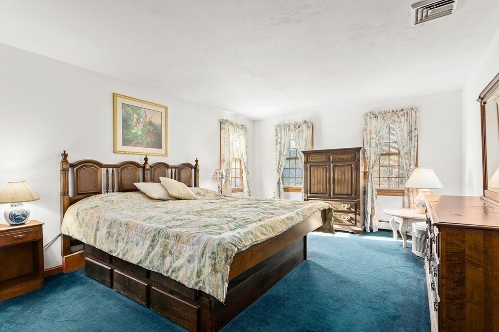 35 Deer Run Road Wrentham, MA 02093 - Photo 20 of 39 a spacious bedroom with a bed and furniture
