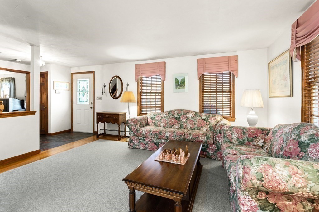 35 Deer Run Road Wrentham, MA 02093 - Photo 8 of 39 a living room with furniture and a large window